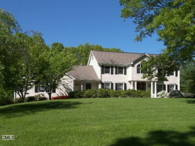 17 Country Club Road Seymour, CT 06483 - Photo 1 of 1 a view of a white house with a big yard and potted plants and large trees