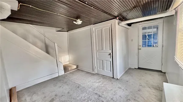 a view of a livingroom with white walls