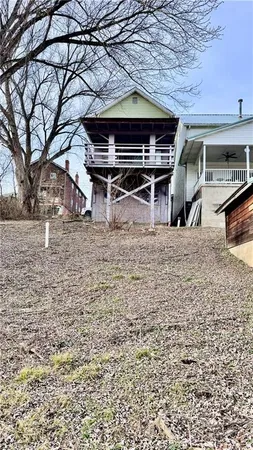 a view of a yard with a tree