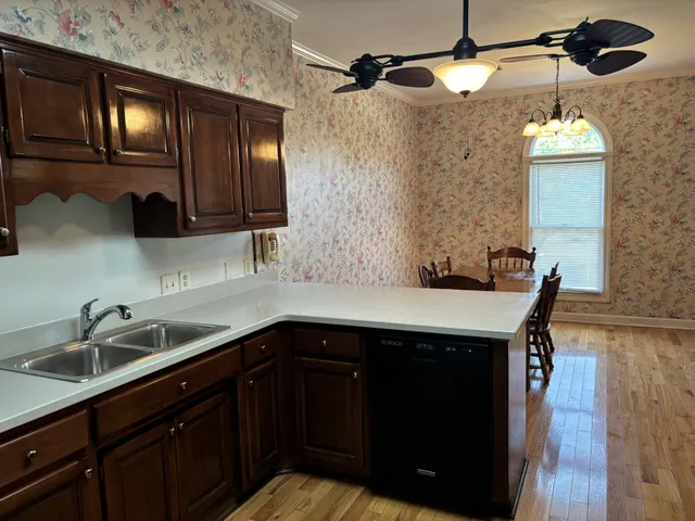 a kitchen with a sink and cabinets