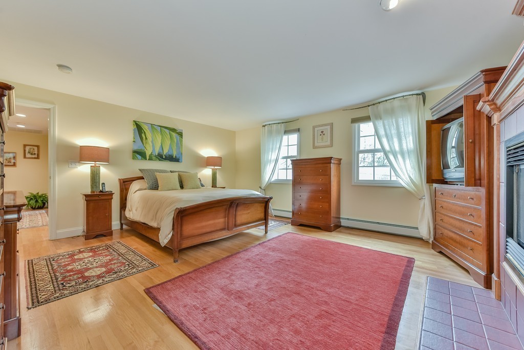 15 Whitney Road Newton, MA 02460 - Photo 13 of 23 a bedroom with a large bed and a dresser