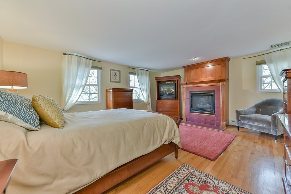15 Whitney Road Newton, MA 02460 - Photo 14 of 23 a spacious bedroom with a bed and wooden floor