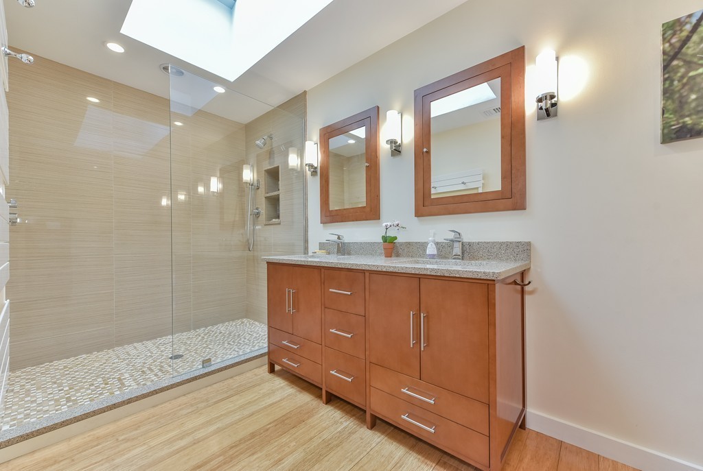 15 Whitney Road Newton, MA 02460 - Photo 16 of 23 a bathroom with double vanity sink and a mirror