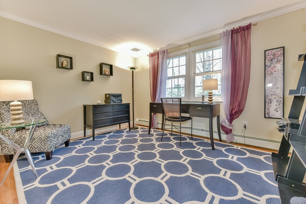 15 Whitney Road Newton, MA 02460 - Photo 17 of 23 a living room with furniture and a lamp