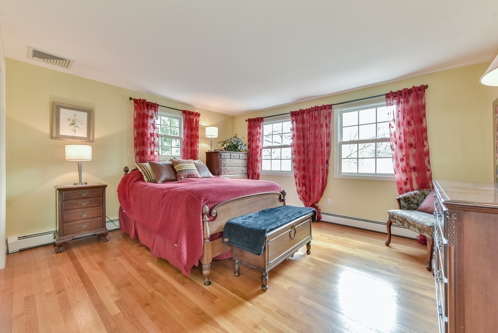 15 Whitney Road Newton, MA 02460 - Photo 20 of 23 a spacious bedroom with a bed and wooden floor