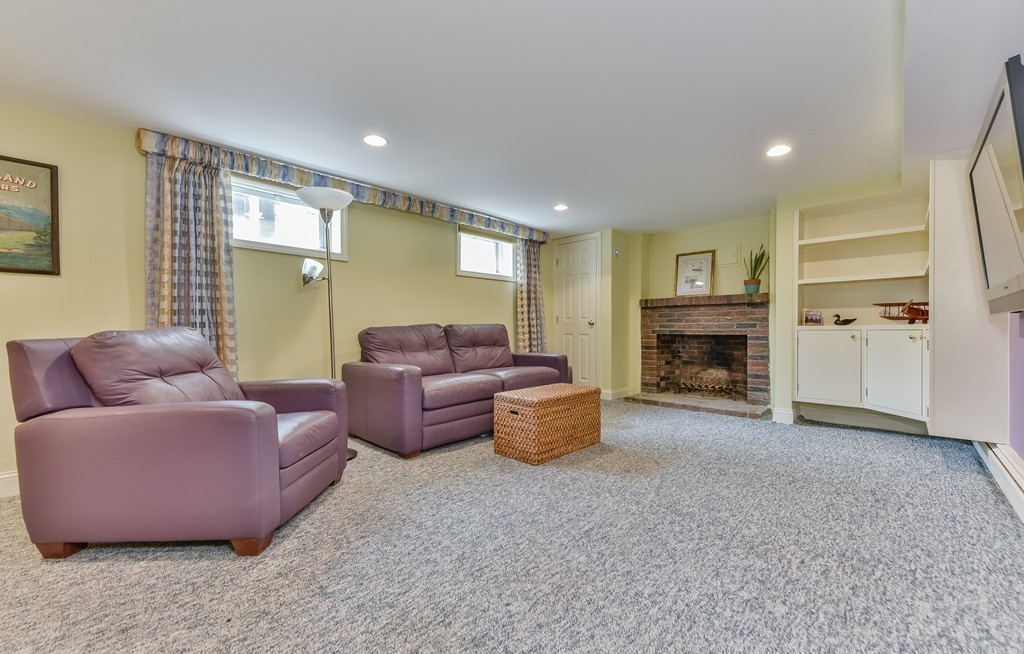 15 Whitney Road Newton, MA 02460 - Photo 21 of 23 a living room with furniture and a fireplace