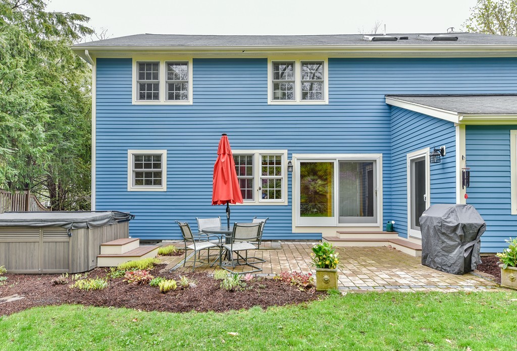 15 Whitney Road Newton, MA 02460 - Photo 23 of 23 a front view of a house with garden and chairs