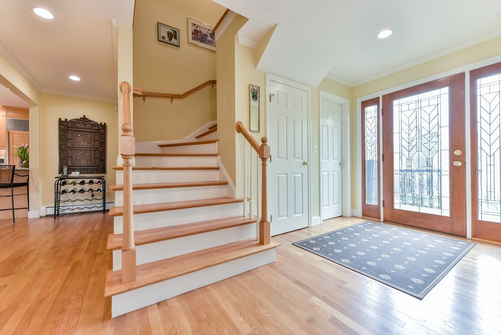 15 Whitney Road Newton, MA 02460 - Photo 3 of 23 a view of an empty room with stairs and a window