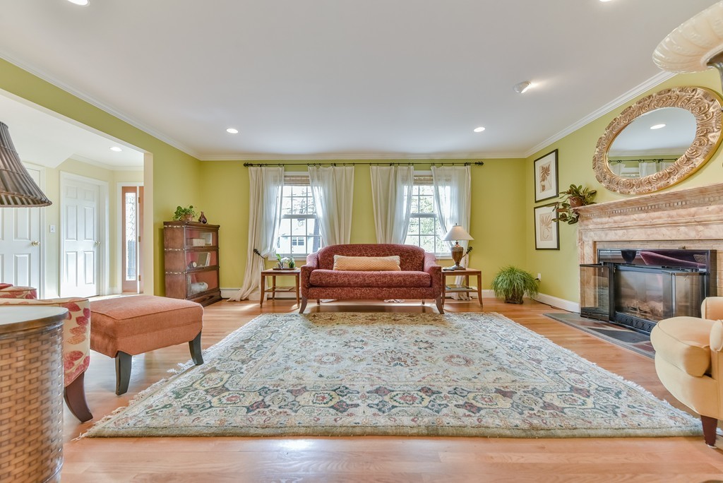 15 Whitney Road Newton, MA 02460 - Photo 4 of 23 a living room with furniture and a fireplace