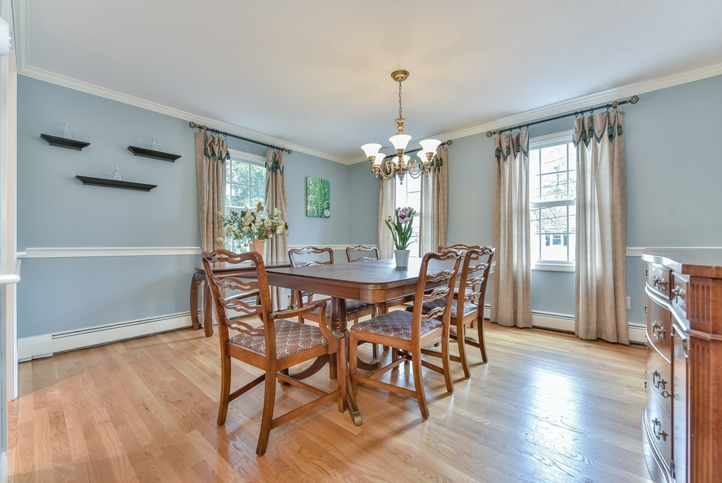 15 Whitney Road Newton, MA 02460 - Photo 7 of 23 a view of a dining room with furniture and wooden floor