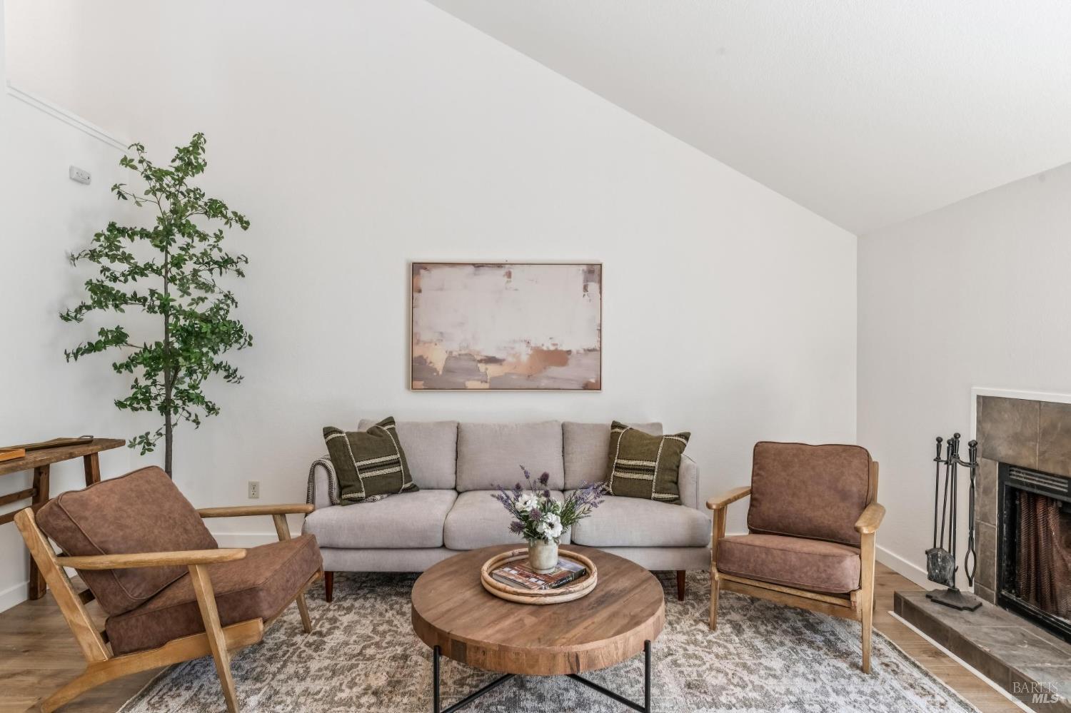 230 Courtyards East Windsor, CA 95492 - Photo 2 of 22 a living room with furniture potted plant and a fireplace
