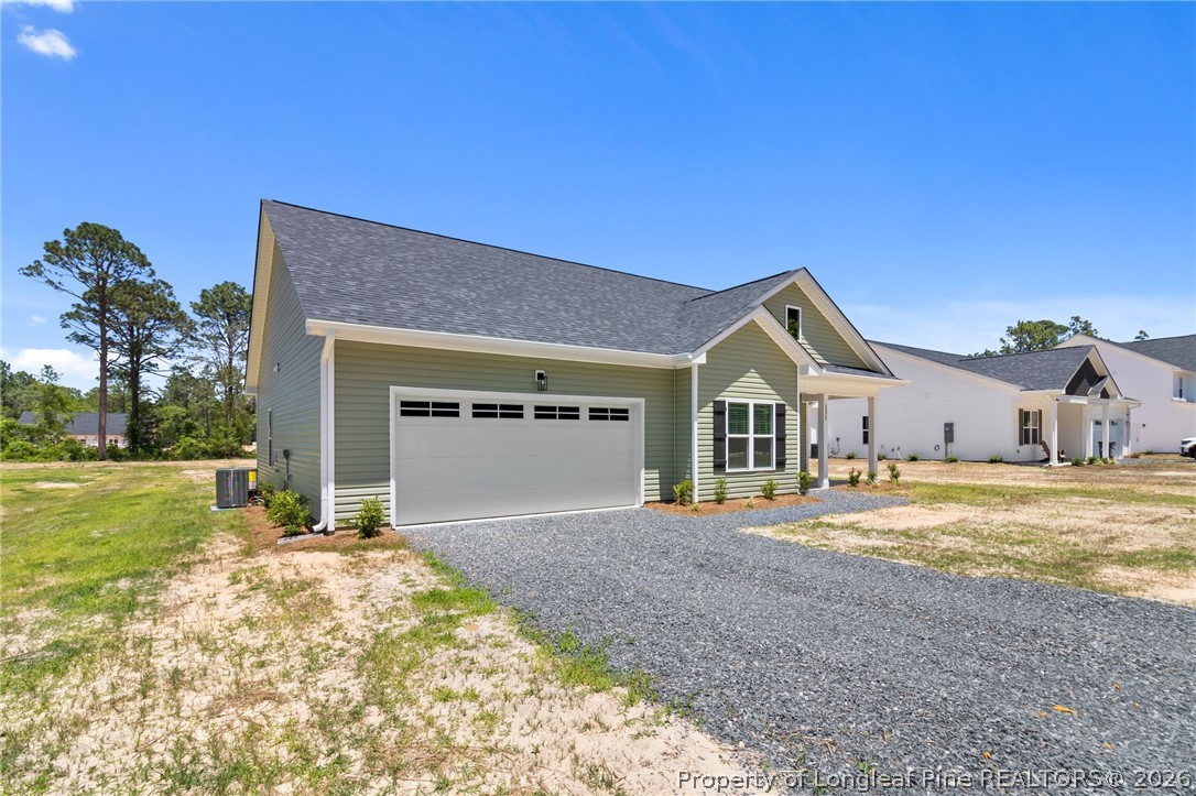 131 Merle Road Pinebluff, NC 28373 - Photo 3 of 33 a front view of a house with a yard