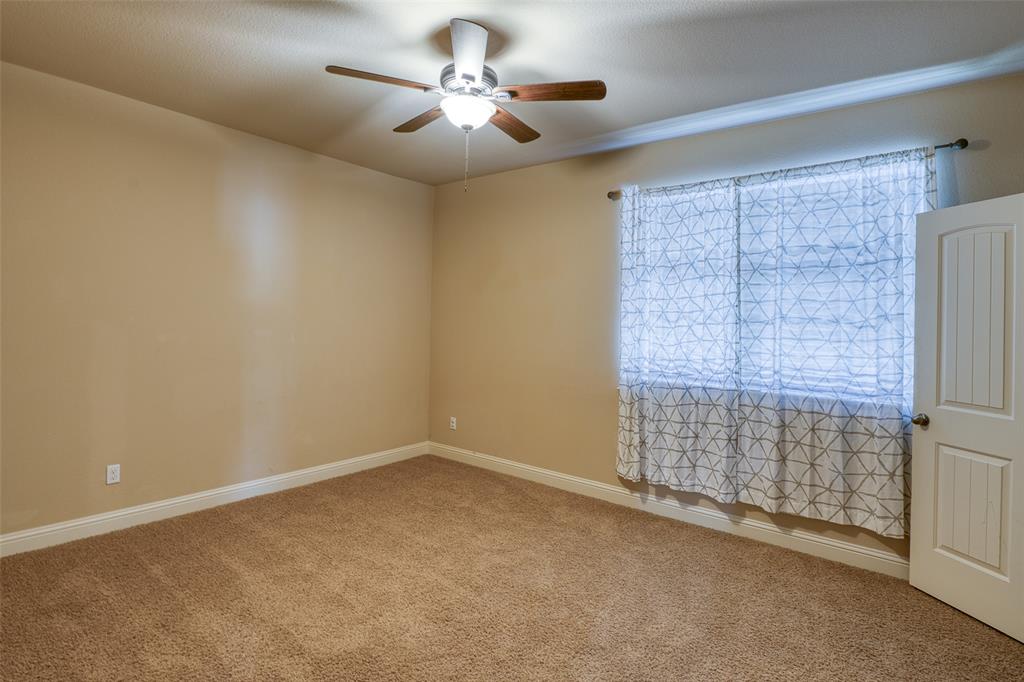 11033 Desert Willow Loop Austin, TX 78748 - Photo 12 of 19 a view of an empty room with a window