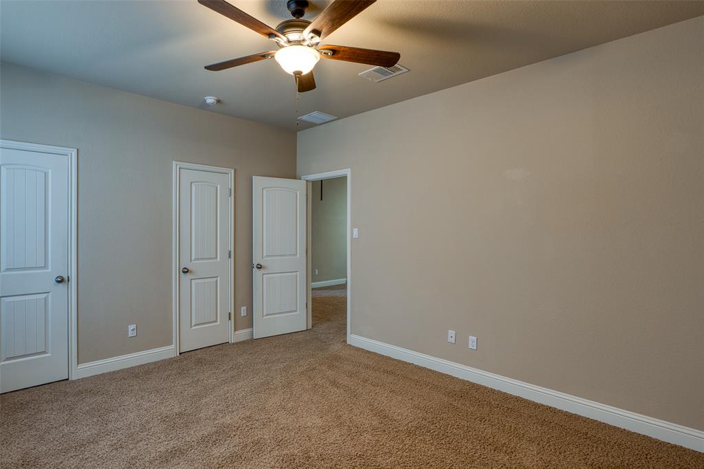 11033 Desert Willow Loop Austin, TX 78748 - Photo 13 of 19 an empty room with closet and a chandelier fan