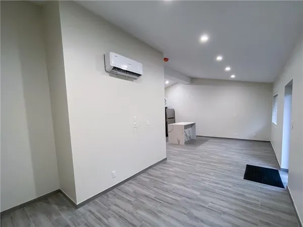 a view of a livingroom with wooden floor