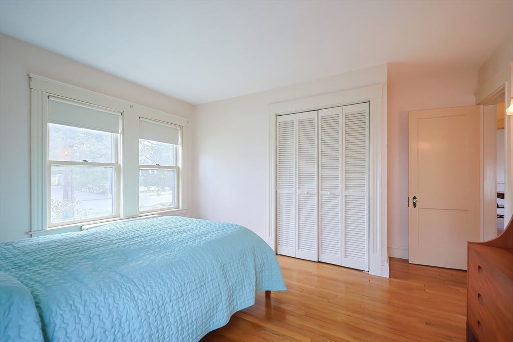 32 Sexton Avenue Westwood, MA 02090 - Photo 17 of 33 a view of a bedroom with wooden floor and windows