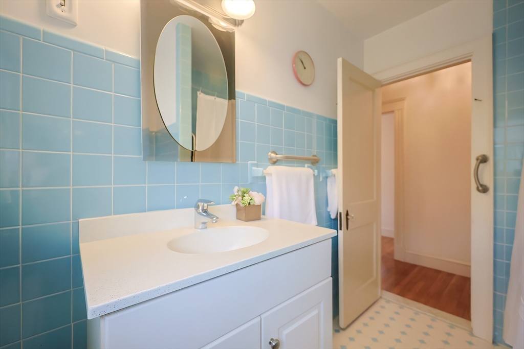 32 Sexton Avenue Westwood, MA 02090 - Photo 20 of 33 a bathroom with a sink and a mirror