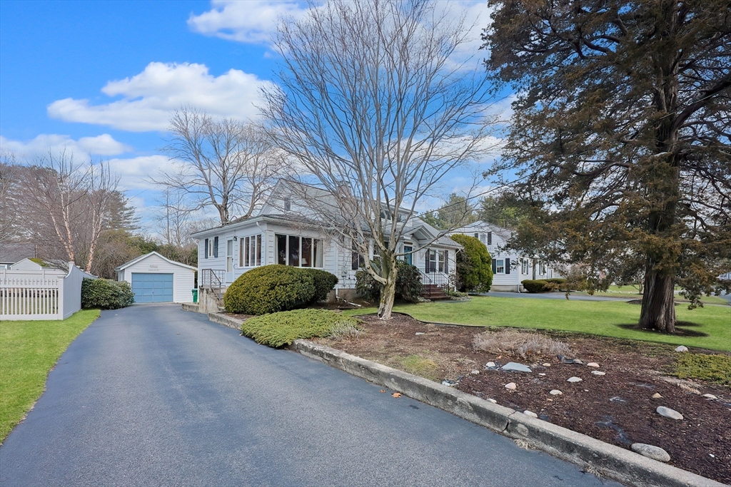 32 Sexton Avenue Westwood, MA 02090 - Photo 2 of 33 a front view of a house with a yard