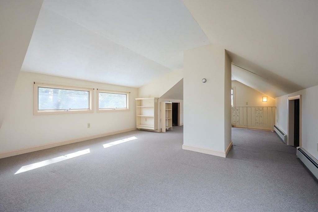 32 Sexton Avenue Westwood, MA 02090 - Photo 25 of 33 an empty room with windows and pillars in it