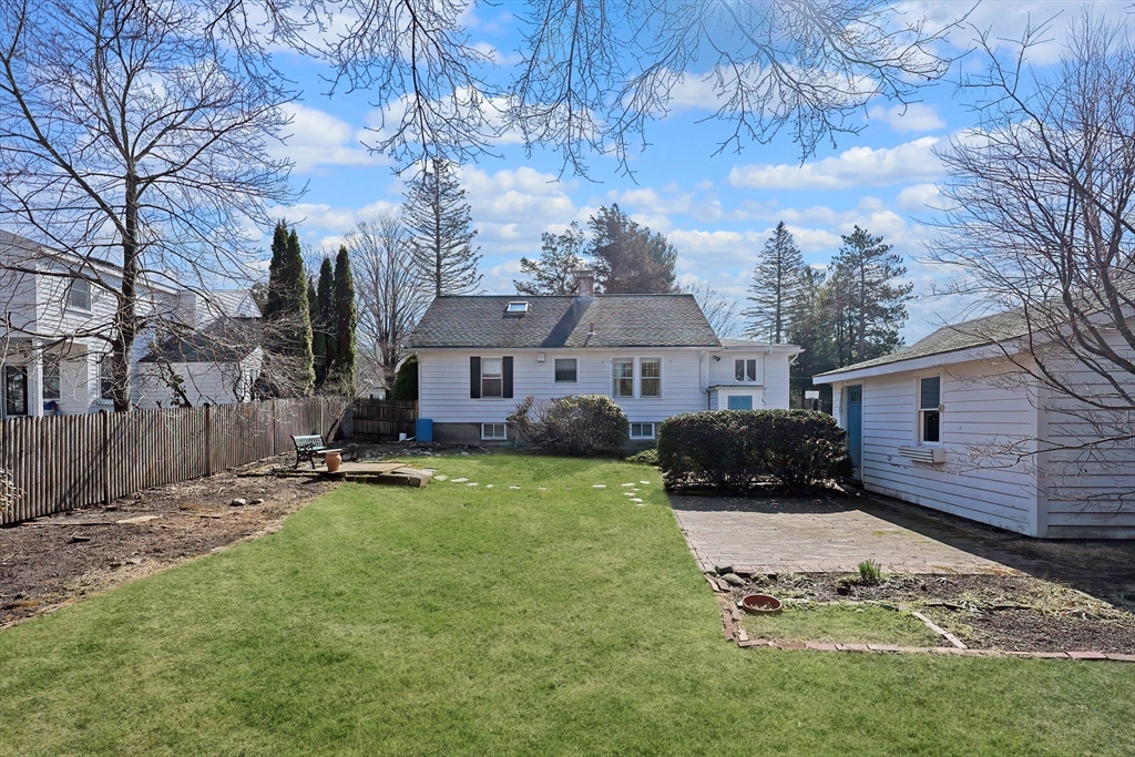 32 Sexton Avenue Westwood, MA 02090 - Photo 33 of 33 a front view of a house with a yard table and chairs