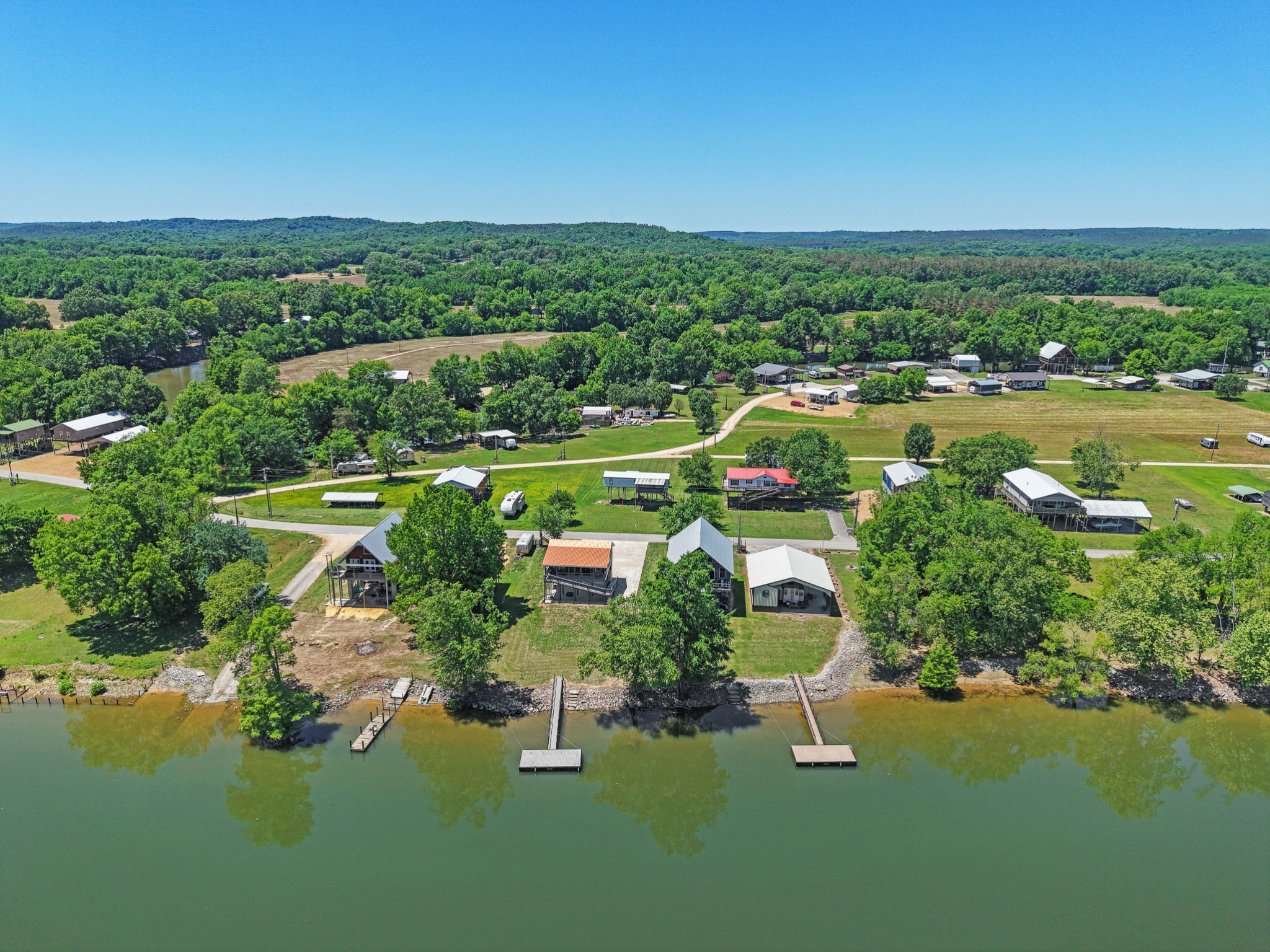 958 Pevahouse Camp Lane Decaturville, TN 38329 - Photo 25 of 32 a view of a lake with a city