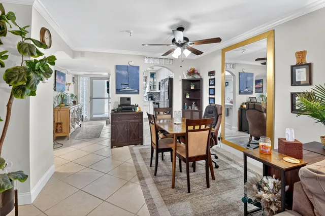 a view of a livingroom with furniture and a potted plant