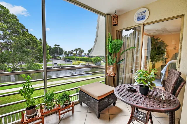 a outdoor living space with furniture and a potted plant