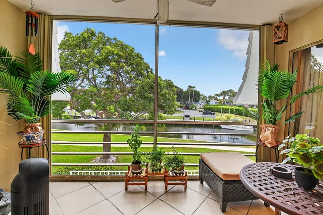 a view of a chairs and table in patio