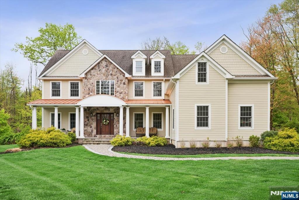 8 Forest Drive Mendham, NJ 07945 - Photo 1 of 43 a front view of a house with a yard and porch