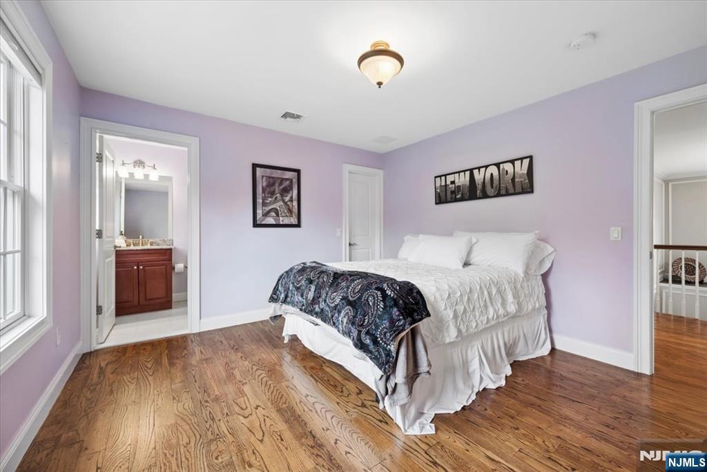 8 Forest Drive Mendham, NJ 07945 - Photo 26 of 43 a spacious bedroom with a bed and a table