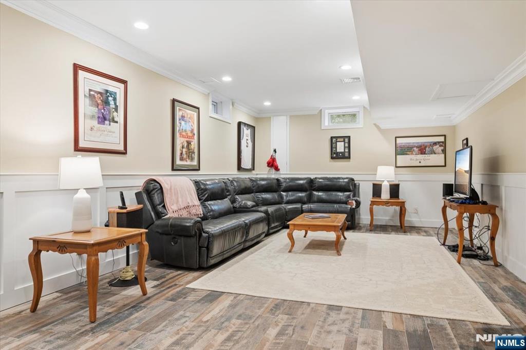 8 Forest Drive Mendham, NJ 07945 - Photo 31 of 43 a living room with furniture and a dining table with kitchen view