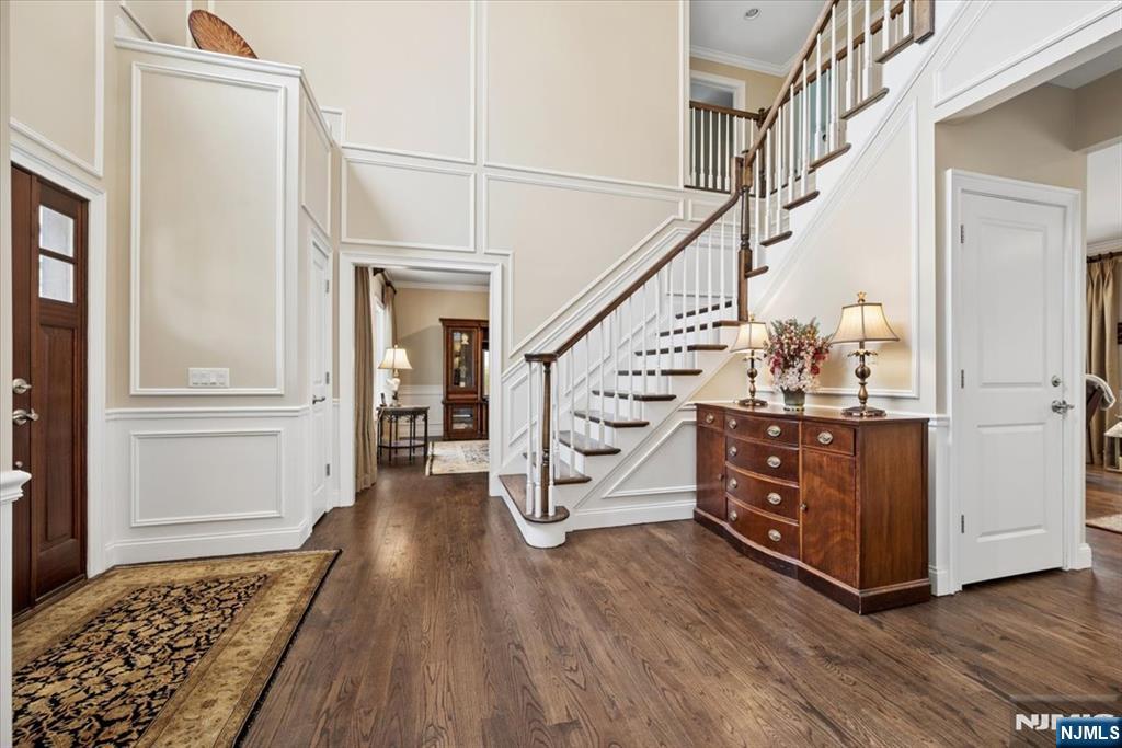 8 Forest Drive Mendham, NJ 07945 - Photo 6 of 43 a room with lots of white furniture and wooden floor