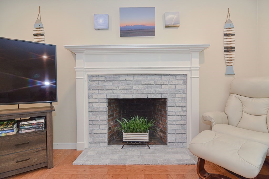 61 Tarpon Road Falmouth, MA 02536 - Photo 15 of 42 a living room with furniture and a fireplace