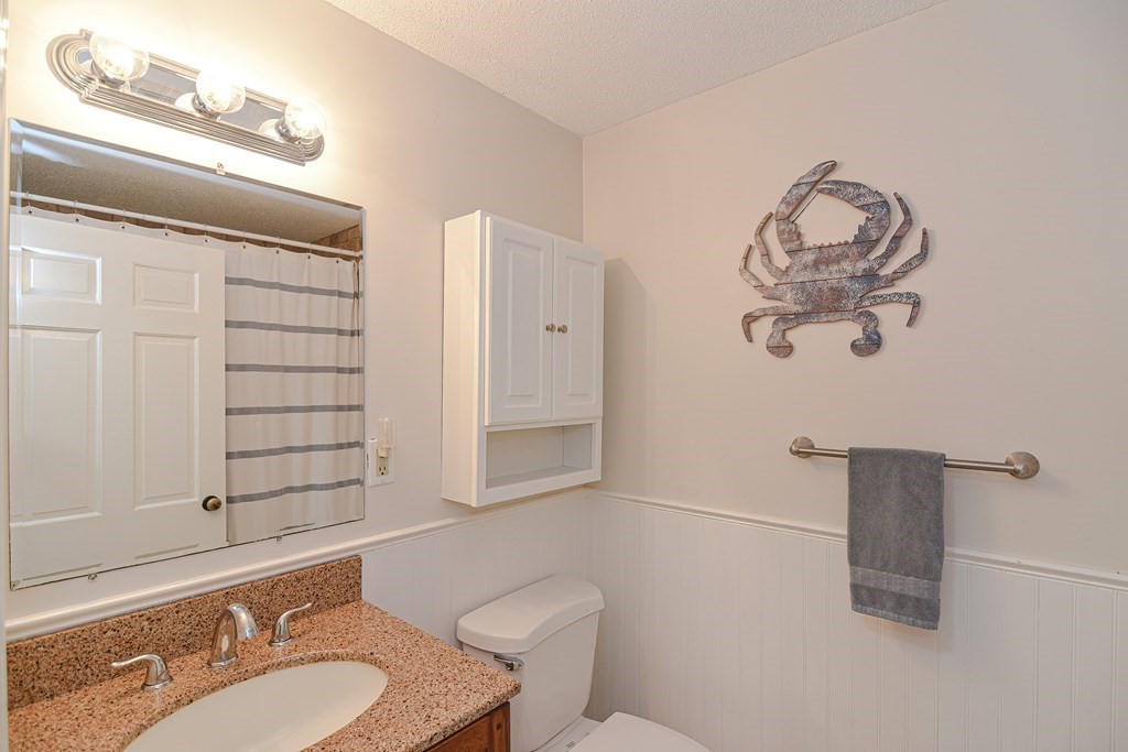 61 Tarpon Road Falmouth, MA 02536 - Photo 24 of 42 a bathroom with a sink a toilet and shower