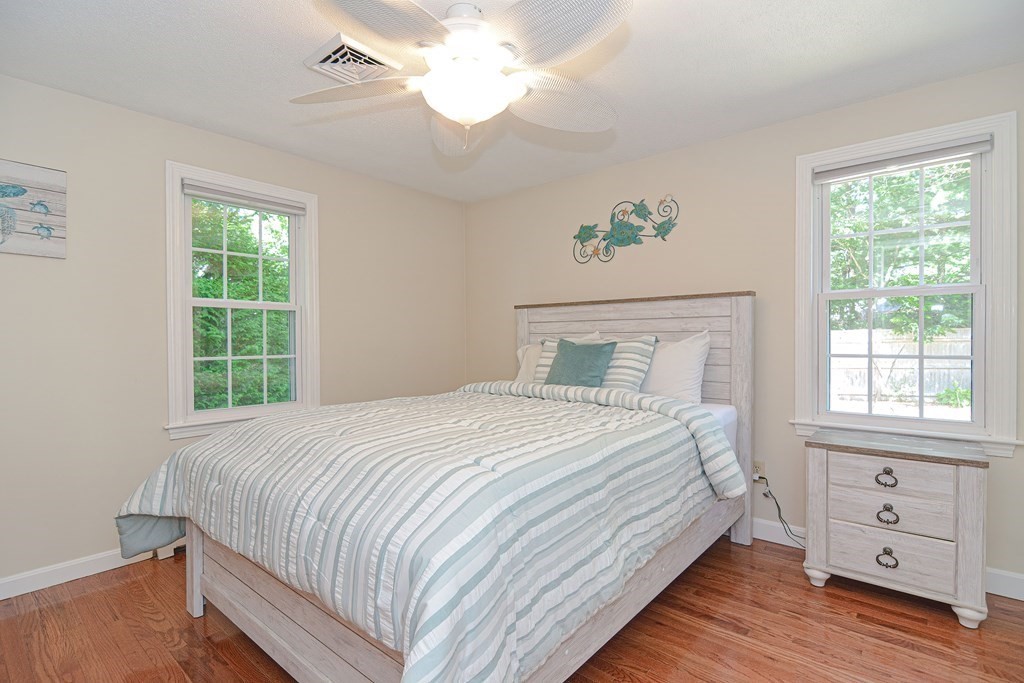 61 Tarpon Road Falmouth, MA 02536 - Photo 3 of 42 a bedroom with a bed and a window
