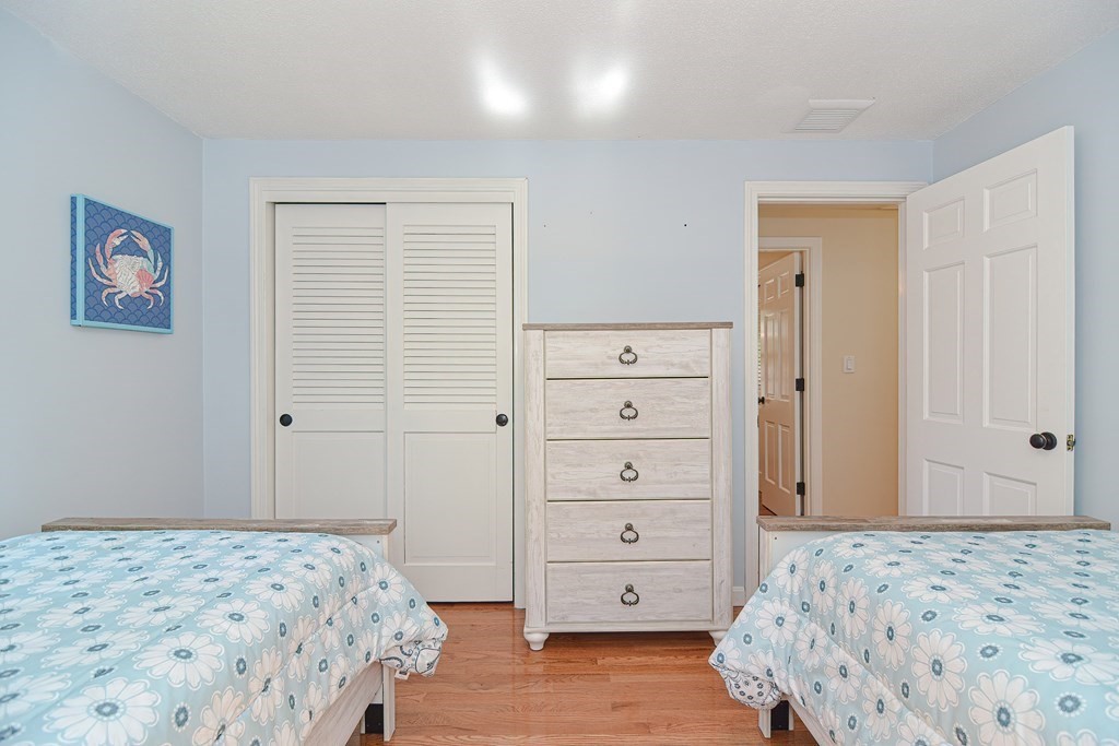 61 Tarpon Road Falmouth, MA 02536 - Photo 31 of 42 a bedroom with a dresser and a window