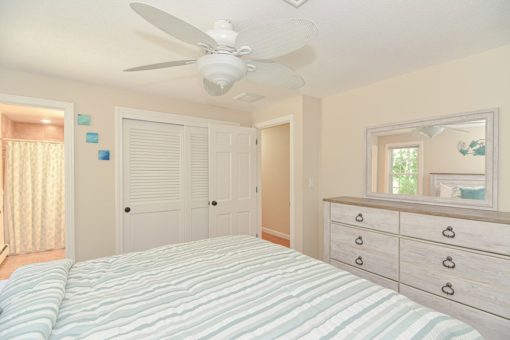 61 Tarpon Road Falmouth, MA 02536 - Photo 36 of 42 a bedroom with a bed and a dresser