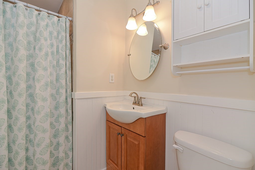 61 Tarpon Road Falmouth, MA 02536 - Photo 37 of 42 a bathroom with a sink a toilet and a mirror