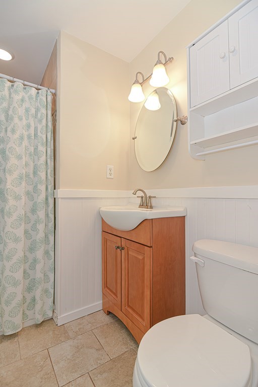 61 Tarpon Road Falmouth, MA 02536 - Photo 38 of 42 a bathroom with a sink a toilet and a mirror