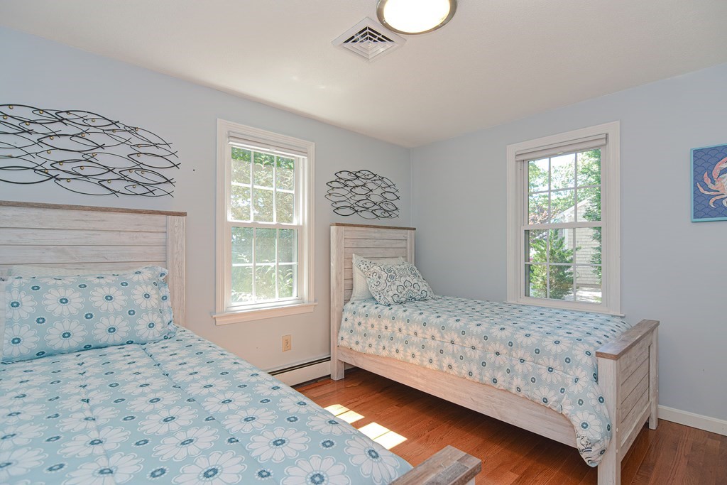 61 Tarpon Road Falmouth, MA 02536 - Photo 39 of 42 a bedroom with a bed and window