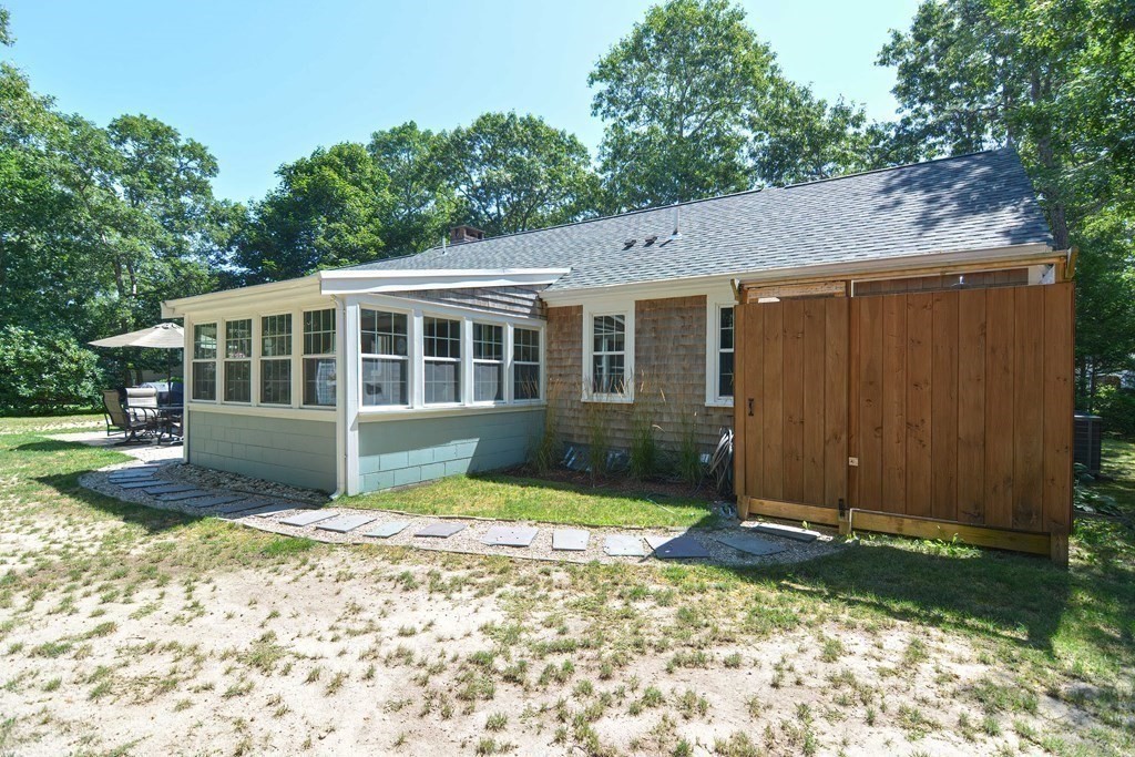 61 Tarpon Road Falmouth, MA 02536 - Photo 8 of 42 a view of front of house with a yard