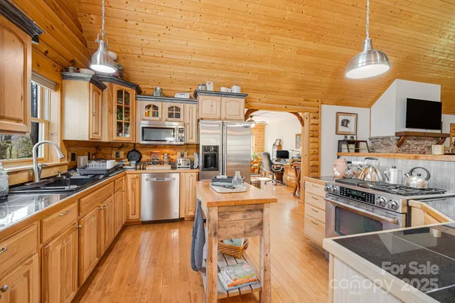 a kitchen with stainless steel appliances granite countertop a stove and a sink
