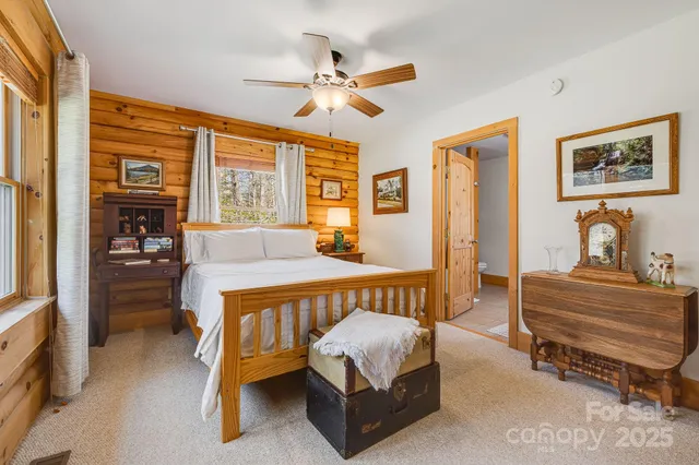 a spacious bedroom with a bed and a table