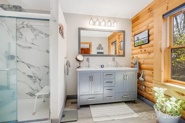 a bathroom with a double vanity sink mirror and