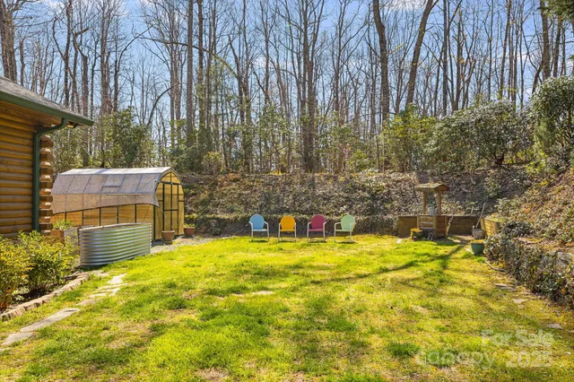 a swimming pool with trees in the background