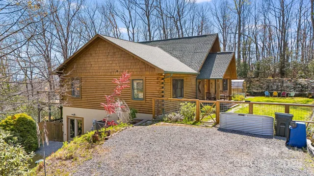 a view of a house with swimming pool and sitting area