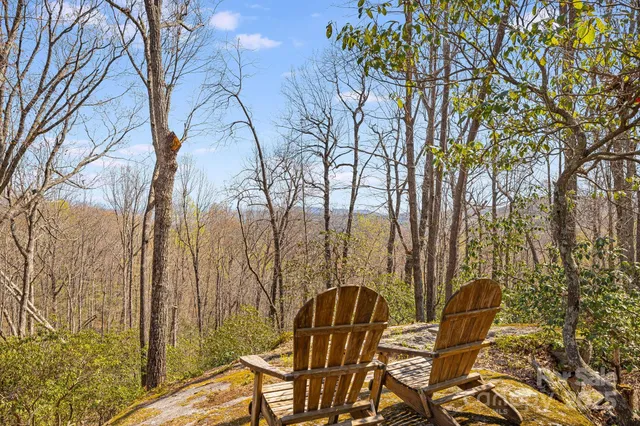 a view of balcony with table and chairs