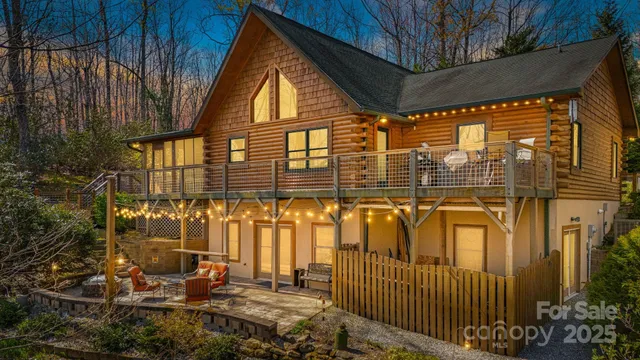 a view of a brick house with many windows