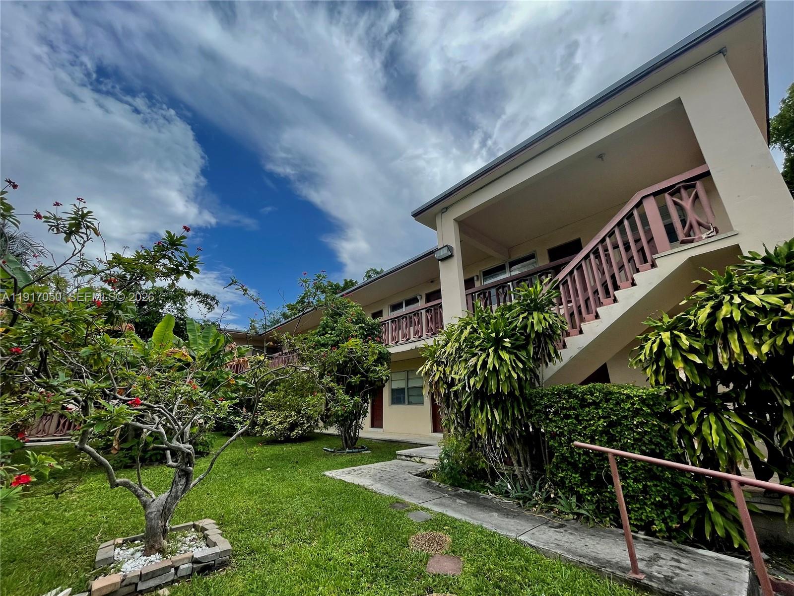 675 Southwest 7th Avenue, Unit 12 Miami, FL 33130 - Photo 2 of 13 a front view of a house with a yard