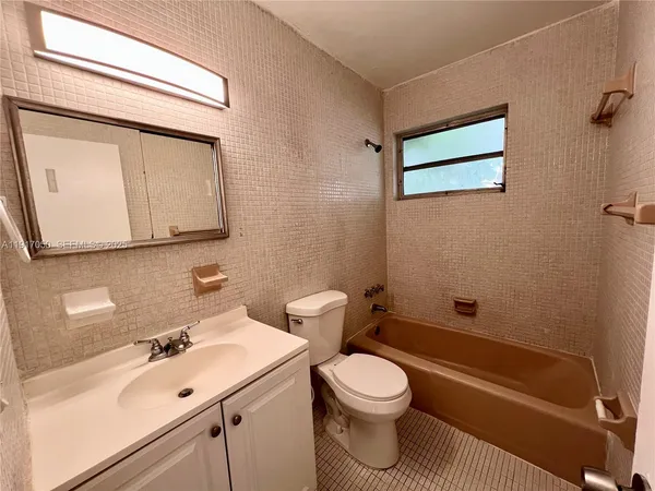 an empty room with a mirror